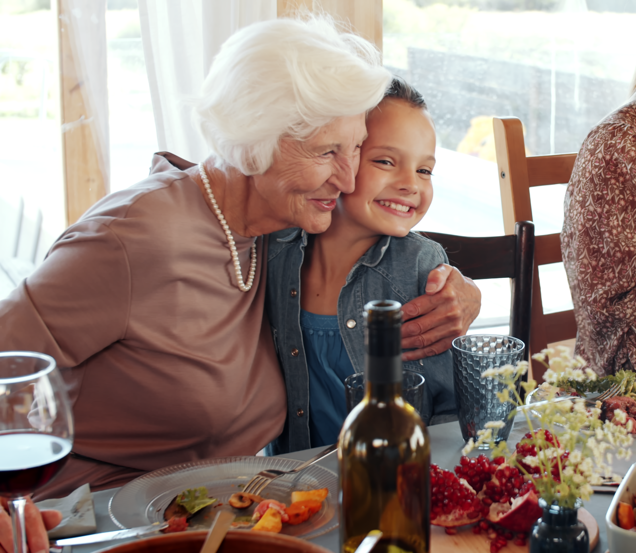 Grandmother and granddaughter hugging